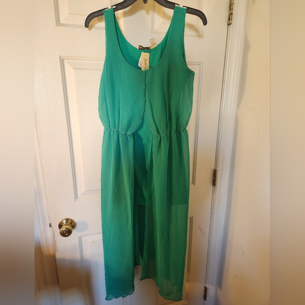 Short sleeveless green dress with sheer maxi covering